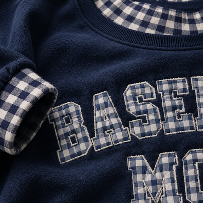 Close up of navy gingham embroidered sweatshirt details